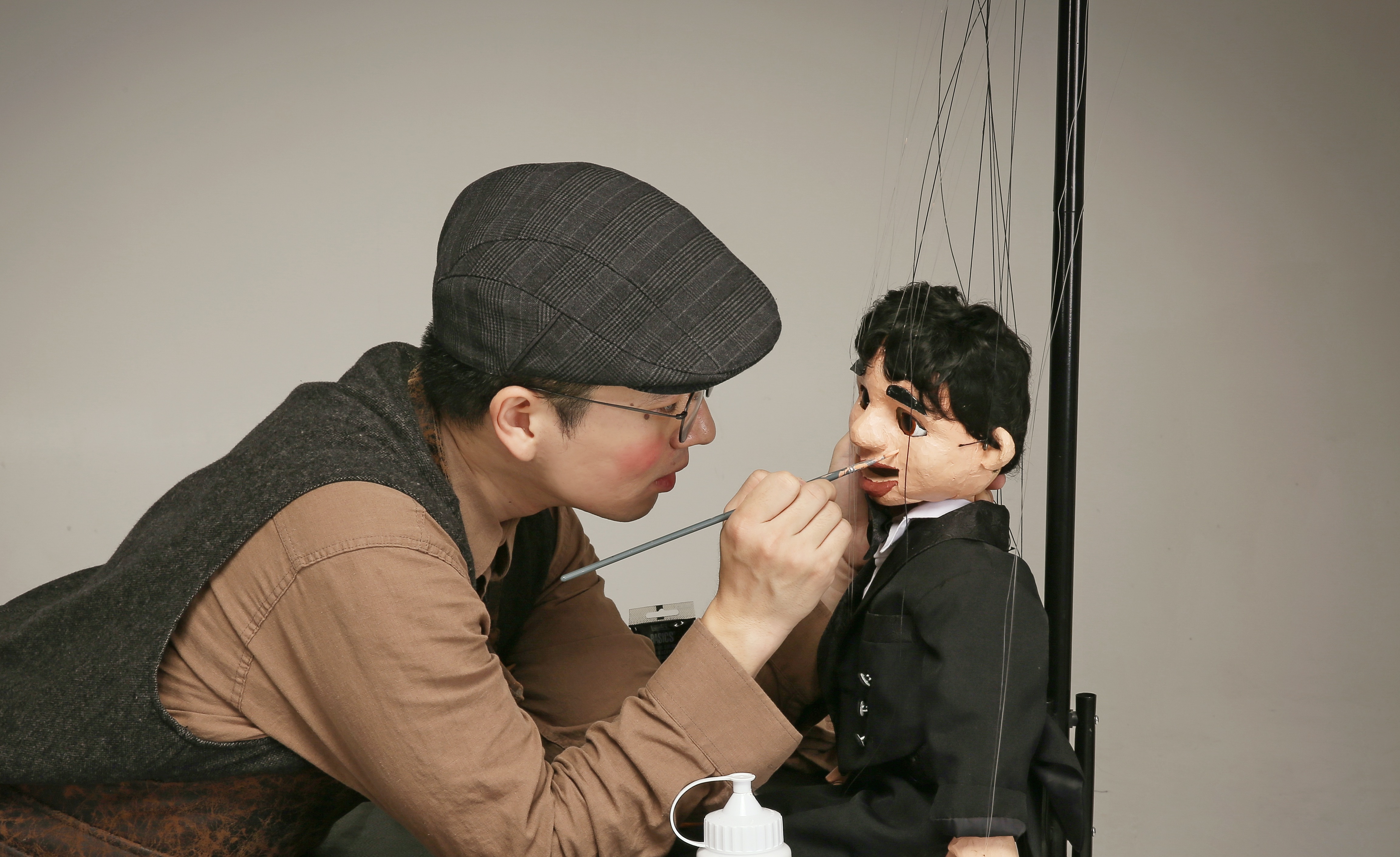 A Young Carpenter with Marionette